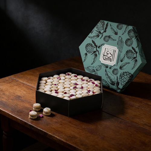 Hala Al Amira - Two layers of petit four with fillings caramel and coconut with sugar powder