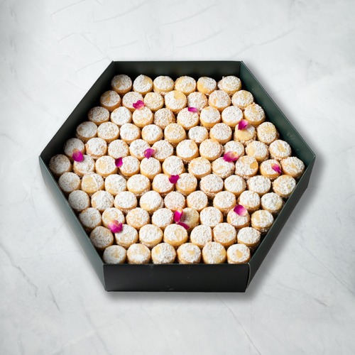Hala Al Amira - Two layers of petit four with fillings caramel and coconut with sugar powder