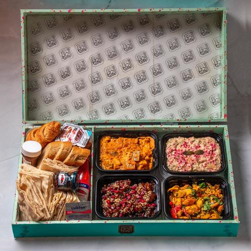 Mini Reyouk - Kadi Mini Breakfast Box A selection of 4 items with baked goods: (Foul – Muttabal – Potatoes – Mushrooms) Served with bread, Nutella, and chili sauce