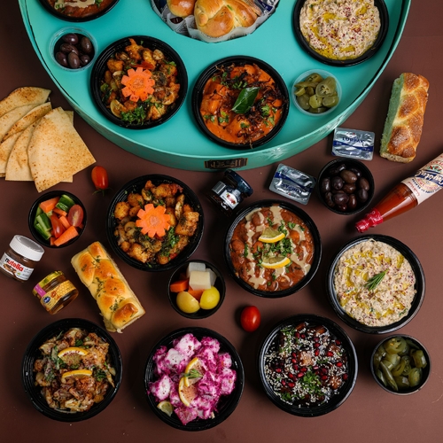 Kadi breakfast - Eggplant Hamsa
Hamsa Mutabal
Hamsa Foul
Hamsa Potato With Mango Agar
Hamsa Zahra
Haloumi Hamsa Halloumi With Mushroom
Feta cheese with beetroot
Black olives - pickles - jalapeno - carrots with cucumber - lebanese bread - brioche - honey - nutella - jam - hot sauce - butter