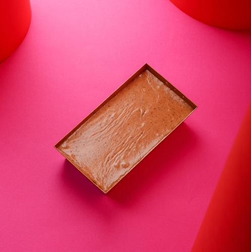 Karak Tramisu - Layers of mixed cream with biscuits and karak tea .