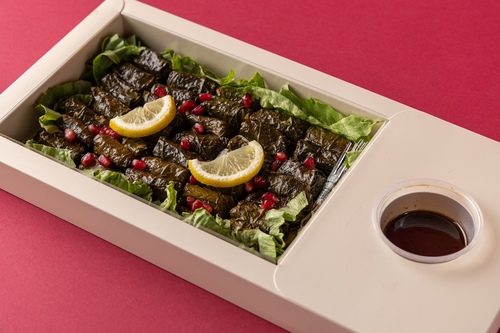 Vine Leaves - Sweet and sour vine leaves plate with pomegranate molasses sauce 35 pieces