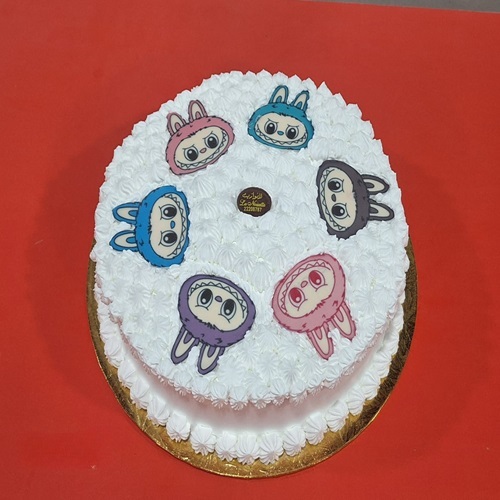 Graduation Cake Labubu face - Layers of vanilla sponge cake with Labubu face طبقات من الكيك الاسفنجي بالفانيلا مع لا بو بو فيس