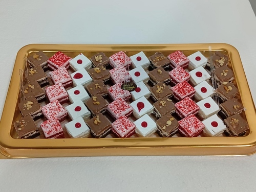 Mini Cakes - Luxurious mini cakes in multiple flavors of vanilla, chocolate, and red velvet, made with the finest ingredients, with soft cream and elegant decorations. Served with coffee.