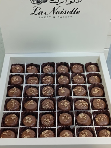 Cotid Al-Rahash - 36 pieces of premium tahini cotid cottage with tahini flavors and a biscuit covered in premium belgian chocolate – a perfect blend of sweetness and sophisticated coffee
