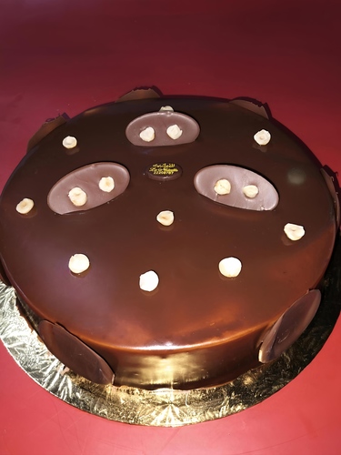 Nutella Cake - Delicious Nutella cake made with soft layers of chocolate sponge cake mixed with rich and appetizing Nutella flavor, with smooth cream and a wonderful chocolate and hazelnut taste.
