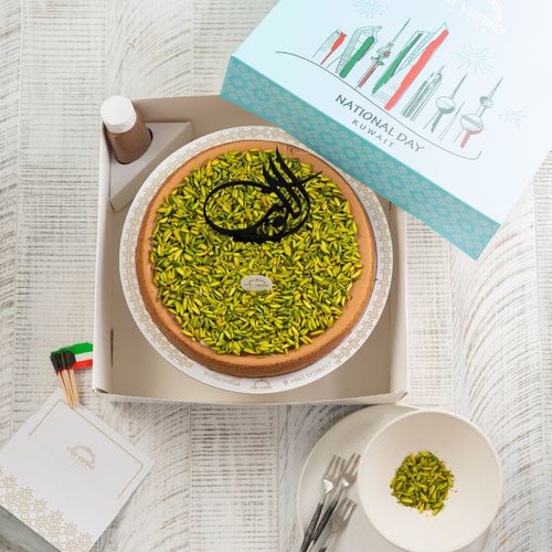 Cheesecake with pistachio  and كويت writing