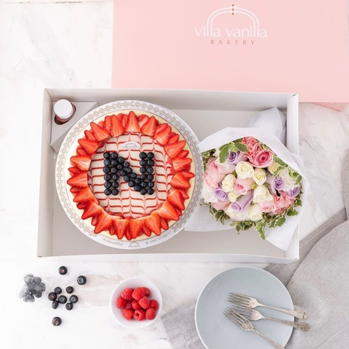 Cheesecake With Letter blueberry strawberry and flowers