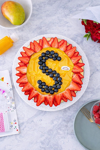 Cheese Cake letter Mango With blueberry and strawberry