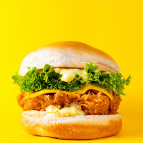 Classic Chicken - A piece of tender fried chicken breast with mustard, mayonnaise, lettuce, pickles and cheddar cheese.