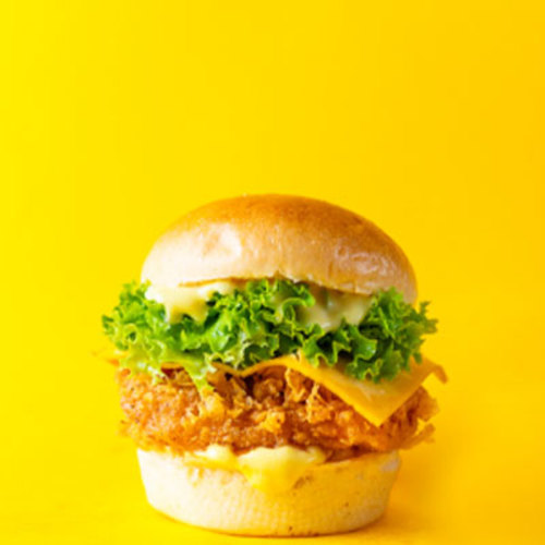 Manhattan Burger - Classic Chicken Slider - Piece of soft fried chicken breast with mustard mayo lettuce pickles and cheddar.