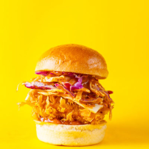 Coleslaw Chicken Slider - Piece of soft fried chicken breast with coleslaw.