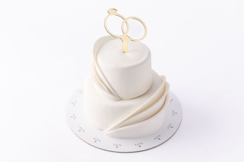 Wedding Cake 1 - An elegant two-tiered 6-inch cake perfect for your special day. Serves 12 to 15 guests and features a delicious blend of vanilla and chocolate flavors.
