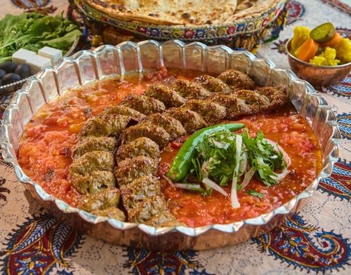 kebab Khashkhash - A meal consisting 3 skewers of kebab served with french fries, tomatoes and tanoor bread