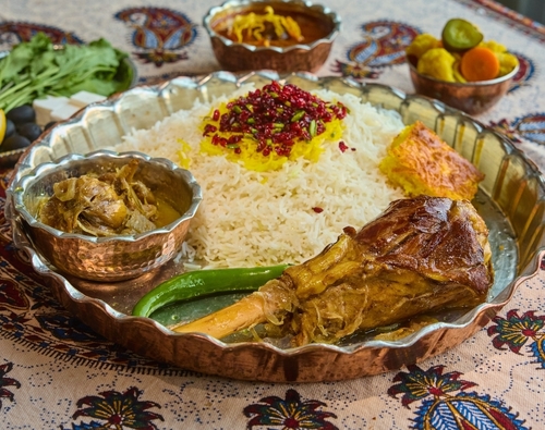 MAhicheh shank with rice - A meal consisting of Moza meat cooked with Iranian spices, served with rice