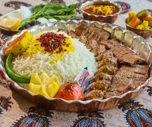 kebab Sultani with rice - A meal consisting of 1 skewers of kebab kobideh and
1 kebab barak skewers served with rice