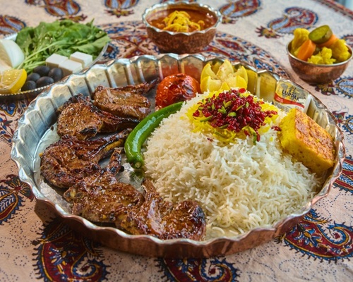 kebab Shashlik with rice - A meal consisting of 4 ribs marinated in the Iranian way, served with rice