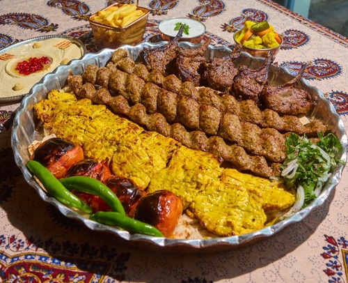 abshar Grill tray (for 4-5 persons) - 4 kebab koobideh  2 jojah kebab 5 pieces of ribs hummus cucumber yogurt