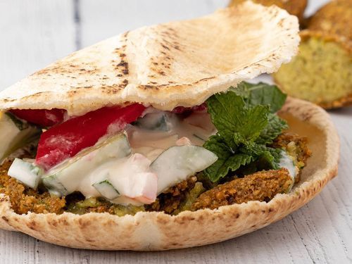 Super Falafel Sandwich - Falafel, tahini, salad, pickles, mint and hummus.