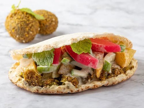 Mesh Bas Falafel - Super Falafel And Potatoes Sandwich - Falafel, potatoes, tahini , salad, pickles, mint and hummus.