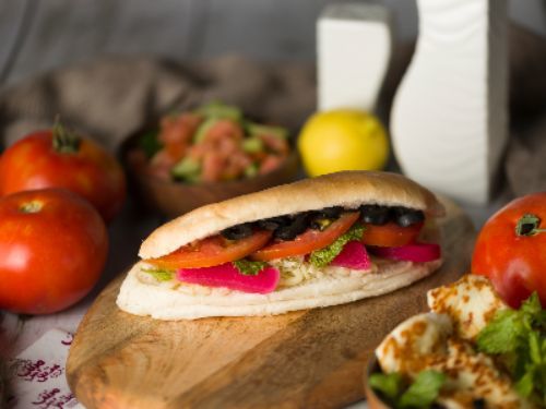 Mesh Bas Falafel - Kashkaval Cheese Sandwich - Kashkaval cheese, mint, tomato and olive.