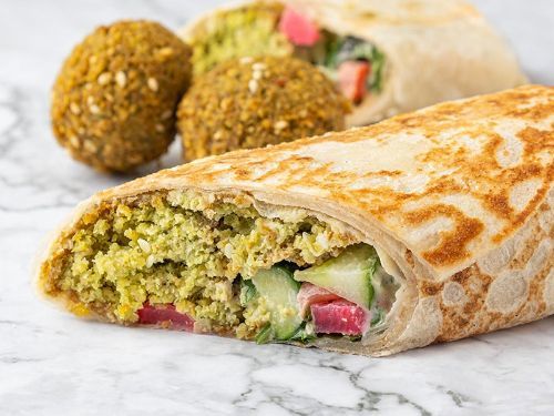 Falafel Saj - Falafel, salad, pickles, mint and hummus.