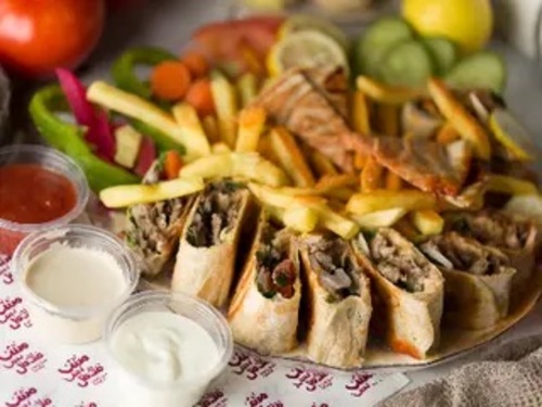 Shamiyat Meat Shawarma Meal Large Size - Saj bites with onion, tomatoes and parsley served with fries tahini sauce and soft drinks