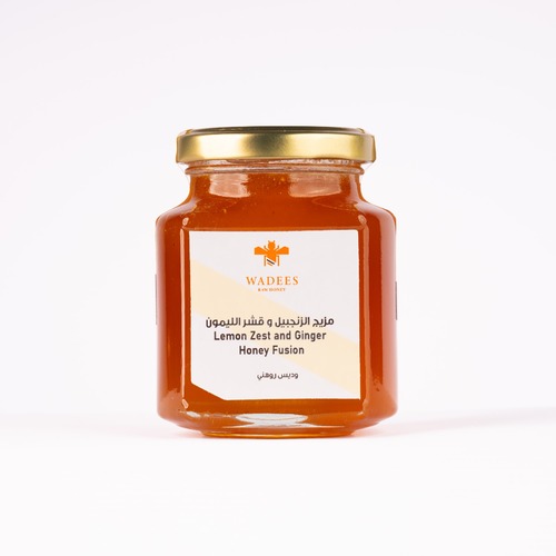 Lemon Zest & Ginger Honey Fusion - Description:
This warm-tasting natural blend acts as an effective antibacterial mixture, combining the richness of Sidr honey, lemon peel, and ginger.Ingredients:
Sidr Honey
Lemon Peel
Ginger
Benefits:
Helps treat respiratory infections, colds, and flu
Soothes a sore throat
Regulates blood sugar levels
Relieves menstrual pain in women
Supports natural weight loss
Side Effects:
Not recommended for individuals allergic to honey or bee products
Usage Instructions:
Mix one medium spoon with 1/4 cup of lukewarm water
Best taken on an empty stomachWeight: 275g