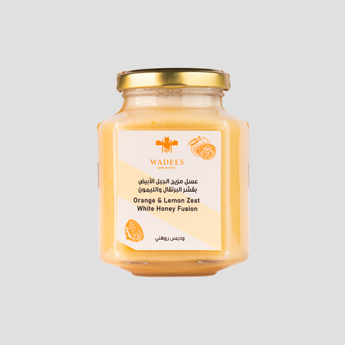 orange & lemon zest white honey fusion - Orange & Lemon Zest White Honey Fusion: A blend of the sour taste of orange and lemon zest with white mountain honey extracted from the nectar of lavender and chamomile flowers from our apiaries in Kyrgyzstan. It is considered a healthy and delicious alternative to ice cream when chilled. Store it in a cool place (refrigerator)
Ingredients: White mountain honey, Orange Zest, Lemon Zest.
Benefits: - Antibacterial and antifungal. - Soothes the throat. - Source of energy. - Soothes the skin. - Rich in antioxidants.
Symptoms: Not recommended for those allergic to honey.
How to Use: The honey can be added to various recipes to enhance flavor and add sweetness.