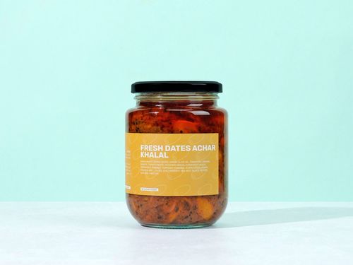 Fresh Dates Khalal Achar - A unique Barhi achar with a mildly spicy flavor and delightful crunch, made from natural ingredients and prepared in a homemade style using extra virgin olive oil.Ingredients: barhi dates, extra virgin olive oil, tomatoes, onions, ginger, tomato paste, mustard seeds, coriander seeds, coriander powder, turmeric powder, cumin seeds, cumin powder, bay leaves, chili powder, sea salt, black pepper, natural vinegar. No sugar added. Net weight: 750 g