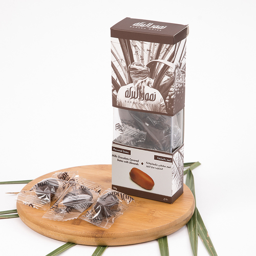 WindowBox - Khudri Almond Milk Chocolate 150gm - The Khudri date is distinguished by its high quality, exceptional nutritional value, and moderately sweet taste. It surpasses others in its ability to maintain quality for a long period and its resistance to heat. Additionally, it is suitable for diabetic patients and is one of the most commonly used dates for stuffing.