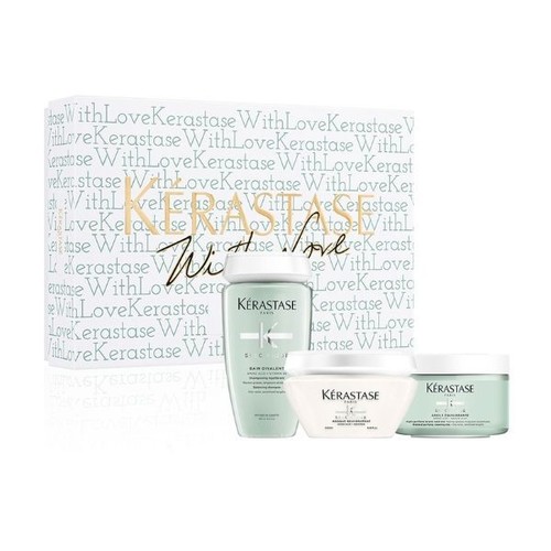 Yasmine Hair Boutique - Kerastase with Love Divalent Mask Gift Set - The Divalent Mask Gift Set by Kerastase is a hair care package that includes a shampoo, a conditioner, and a hair mask designed for individuals with oily roots and dry ends. This gift set is perfect for those who want to achieve balanced and healthy-looking hair. The set includes a shampoo, conditioner, and hair mask that work together to regulate excess oil production on the scalp while also nourishing the hair. If you're looking for a comprehensive hair care solution, the Divalent Mask Gift Set by Kerastase is definitely worth considering. Set includes: • Bain Divalent Shampoo  • Specifique Masque Rehydratant  • Argile Equilibrante