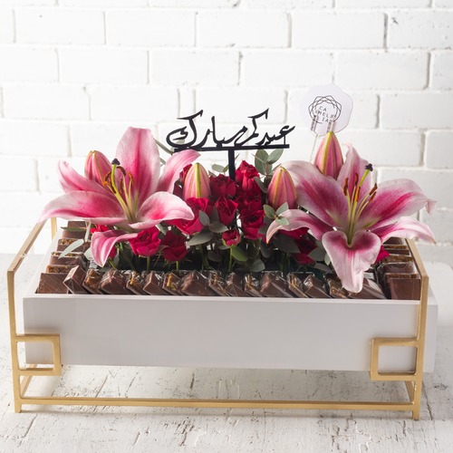 A Rectangular Art Stand - Wooden rectangular plate size length 48 cm width 28 cm height 17 cm with kilo and half chocolate and fresh flowers at the middle.