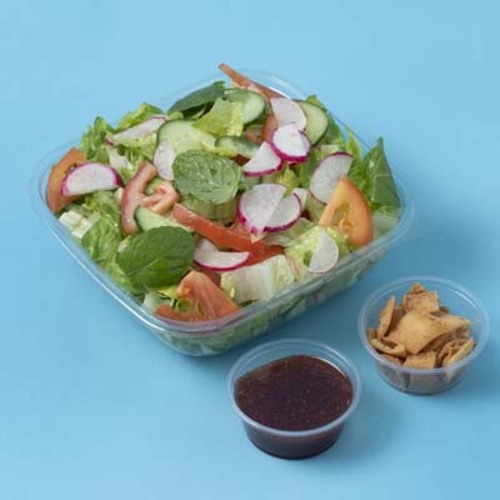 Fattoush - Fattoush salad served with special sauce and toasted pieces of bread.