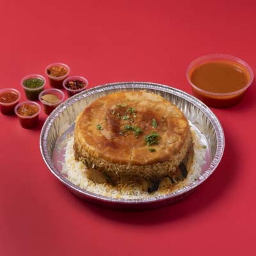 Meat Maqluba - A traditional dish made with assorted vegetables and tender meat pieces, layered with white rice and flipped upside down for a rich, irresistible flavor