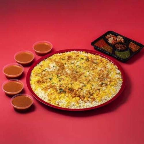 Tray Biryane Meat - Kuwaiti Meat Biryani Tray – served with premium Basmati rice, signature Biryani mix, Daqoos sauce, and five varieties of pickles & side dishes.