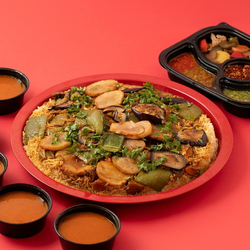 Meat Maqluba Tray - Meat Maqluba tray made of layered rice, Australian meat, and cooked vegetables, flipped onto the serving tray for an appetizing presentation