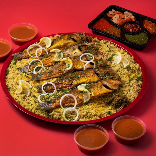 Seabass Mtabbag Tray - Seabass Mtabbag tray served with fish rice, Seabass fillet, Daqoos, five varieties of Mabooj, and Achar.