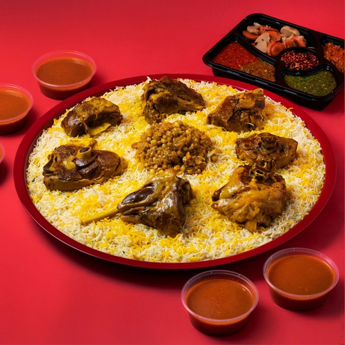 Meat Majboos Tray - Australian Meat Majboos tray served with premium basmati rice, authentic Kuwaiti stuffing, Daqoos sauce, five varieties of Mabooj, and Achar.
