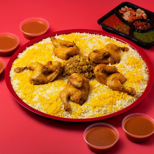 Chicken Majboos Tray - Chicken Majboos tray served with premium basmati rice, chicken with authentic Kuwaiti stuffing, Daqoos sauce, five varieties of Mabooj, and Achar.