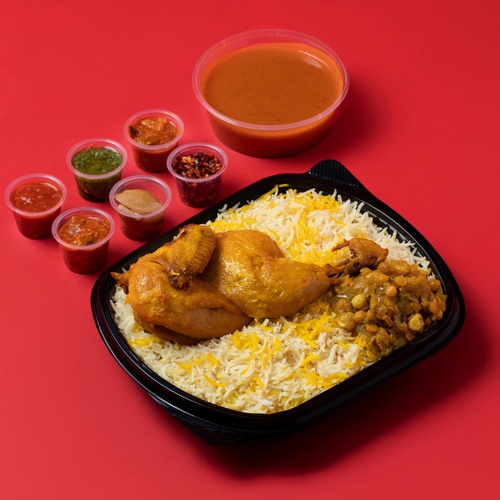 Chicken Majboos - Chicken Majboos with Kuwaiti stuffing and half a chicken, served with Daqoos, five varieties of Mabooj, and Achar.