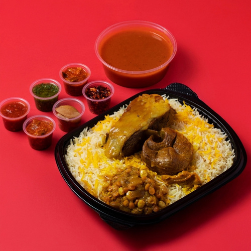 Meat Majboos - Meat Majboos (Australian or Arabic) served with fluffy rice and stuffing, along with Daqoos, five varieties of Mabooj, and Achar
