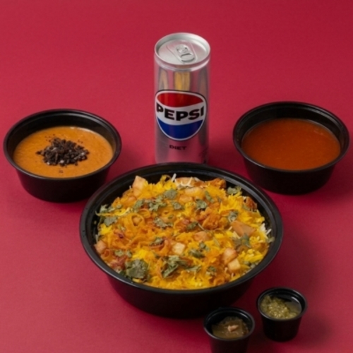 Chicken Biryani Combo - quarter chicken served with rice, biryani sauce, and daqous sauce, plus an appetizer of your choice and a soft drink