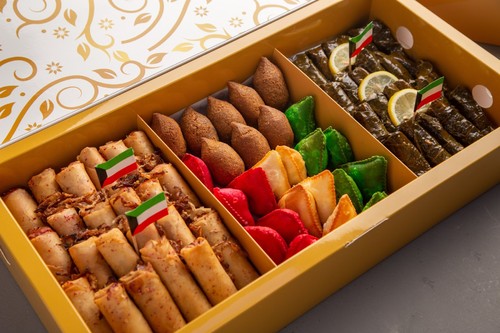 Zawara Box Kuwait Flag - Box of vine leaves with lemon, bulgur kibbeh, barak mix, and chicken musakhan rolls, 75 pieces.