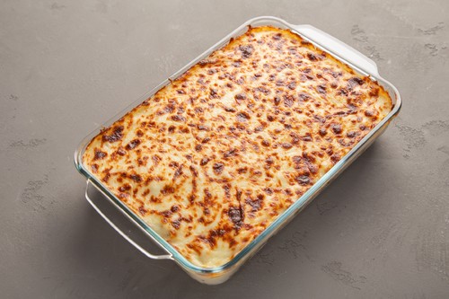 Bechamel Al-Taybeen with minced meat and tomato sauce