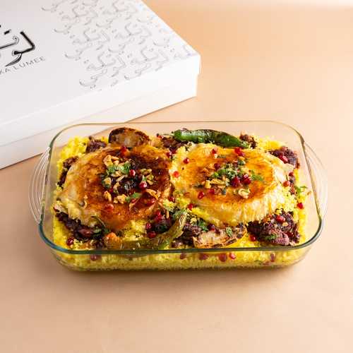 Chicken Rice Pyrex - 1 and half bonless chicken in layers of zaffron rice served with cucmber yoghurt and onion sauce
