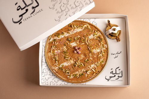 Zaffron sweet - Layers of vanilla cake with saffron cream, garnished with pistachios, almonds and roses, served cold with our special karak sauce.