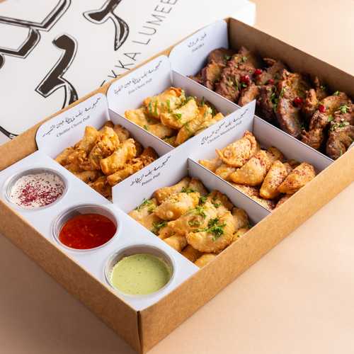 Mix Frying Box - Contain mix of frying items ( feta puff - potato puff - chedder puff - chkn musakhan puff) served with three kind of sauce .