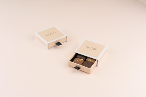Chocolate box - 4 pieces - Angelina offers a variety of delicious chocolate in its elegant box with your choice of different flavors, GIANDUJA LIME, GIANDUJA PRALINE, HAZELNUT PRALINE, RED ROSE, RED HEART, CARDAMOM, NEROLI, CARAMEL COULIS, ALMOND SESAME, DARK CHOCOLATE GANACHE, HAZELNUT BONBON