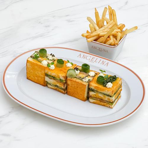 Tuna Club Sandwich - Tuna, basil pesto and cream cheese, avocado and cucumber pickles. Served with French fries.